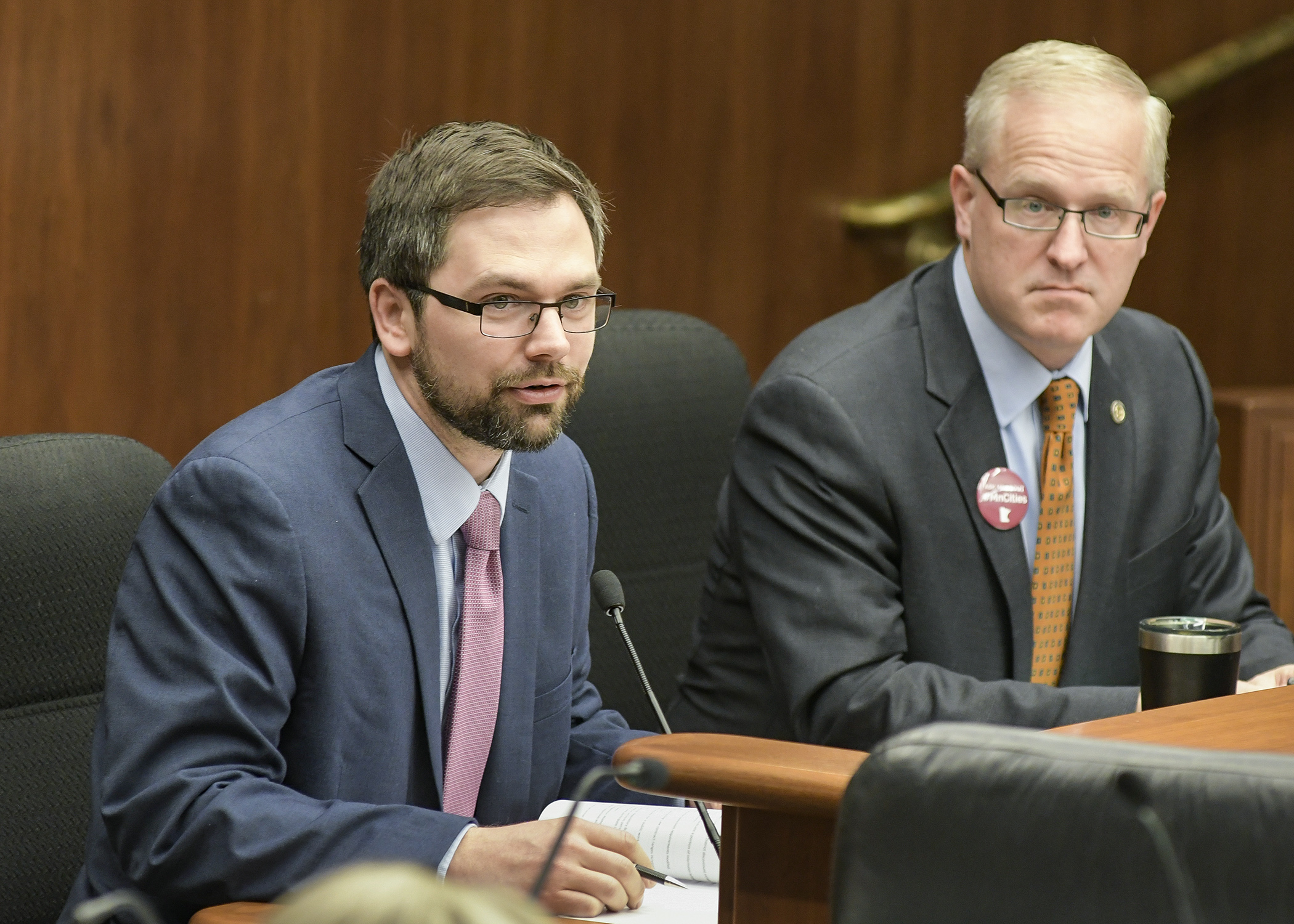 Jon Eichten, MN.IT legislative director, testifies before the House Government Operations and Elections Policy Committee March 22 on a bill sponsored by Rep. Jim Nash, right, that would require state agencies to dedicate a portion of information expenditures to cybersecurity enhancements. Photo by Andrew VonBank